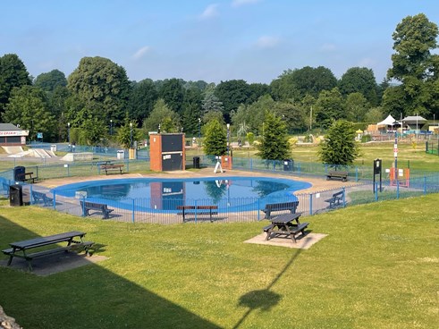 fenced off paddling pool in park