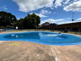large concrete padding pool in park
